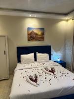 Postel nebo postele na pokoji v ubytování Pyramids Haven Hotel
