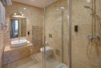 a bathroom with a shower and a toilet and a sink at Hotel Florenc in Prague
