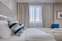 a hotel room with a bed and a window at Hotel Florenc in Prague