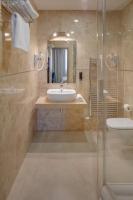 a bathroom with a sink and a shower at Hotel Florenc in Prague