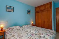 Posteľ alebo postele v izbe v ubytovaní Apartment near the beach with a huge terrace patio, wifi and parking