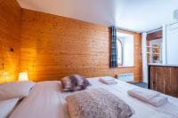 Posteľ alebo postele v izbe v ubytovaní Chalet La Chapelle aux pieds des pistes