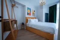 Postel nebo postele na pokoji v ubytování Bird Nest Suites