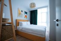 Postel nebo postele na pokoji v ubytování Bird Nest Suites