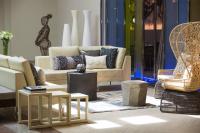 a living room with couches and tables at Renaissance Santo Domingo Jaragua Hotel & Casino in Santo Domingo