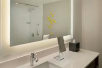 a bathroom with a sink and a shower at Renaissance Santo Domingo Jaragua Hotel & Casino in Santo Domingo