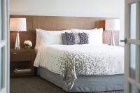 a bedroom with a large white bed with pillows at Renaissance Santo Domingo Jaragua Hotel & Casino in Santo Domingo
