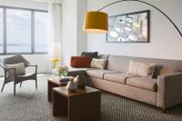 a living room with a couch and a table at Renaissance Santo Domingo Jaragua Hotel & Casino in Santo Domingo