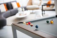 a pool table with balls on it in a living room at Renaissance Santo Domingo Jaragua Hotel & Casino in Santo Domingo