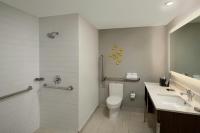 a bathroom with a toilet and a sink at Renaissance Santo Domingo Jaragua Hotel & Casino in Santo Domingo