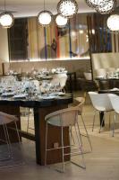 a restaurant with a table with wine glasses on it at Renaissance Santo Domingo Jaragua Hotel & Casino in Santo Domingo