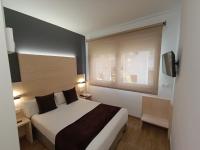 Posteľ alebo postele v izbe v ubytovaní Hotel Travessera