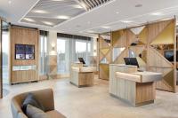 Courtyard by Marriott London City Airportにあるテレビまたはエンターテインメントセンター