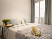 A bed or beds in a room at Cozy apartment in downtown area