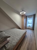 Posteľ alebo postele v izbe v ubytovaní Asti Apartamenty Centrum Stargard