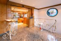 a room with a staircase and a window at Hotel Grünwinkel in Oberharmersbach
