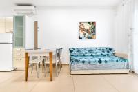 A seating area at Jesolo Sun Beach House - Host Solution