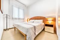 A bed or beds in a room at Jesolo Sun Beach House - Host Solution