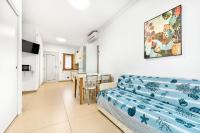 A television and/or entertainment centre at Jesolo Sun Beach House - Host Solution