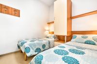 A bed or beds in a room at Jesolo Sun Beach House - Host Solution