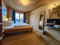 A bed or beds in a room at alpen select lodge Kleinwalsertal