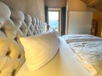 A bed or beds in a room at alpen select lodge Kleinwalsertal