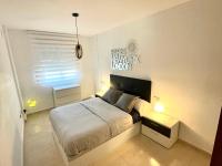 A bed or beds in a room at Pretty bungalow with Prívate terrace
