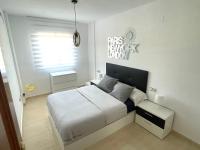 A bed or beds in a room at Pretty bungalow with Prívate terrace