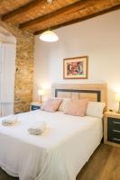 Postel nebo postele na pokoji v ubytování Ganganell Centre Apartamento con Patio