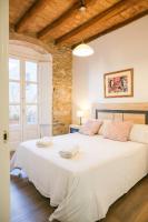 Postel nebo postele na pokoji v ubytování Ganganell Centre Apartamento con Patio