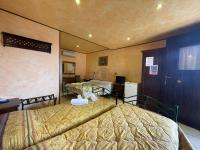 Posteľ alebo postele v izbe v ubytovaní Hotel Villa Elisabetta