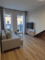 Televízia a/alebo spoločenská miestnosť v ubytovaní Asti Apartamenty Centrum Stargard