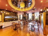 a restaurant with tables and chairs and a bar at APA Hotel Uozu Ekimae in Uozu