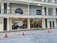 three orange traffic cones in front of a restaurant at K Avenue Sunrise View Condomonium - Kota Kinabalu Airport in Kota Kinabalu