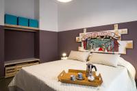 A bed or beds in a room at Cassari UpArtments