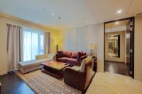 a living room with a couch and a table at ITC Grand Chola, a Luxury Collection Hotel, Chennai in Chennai