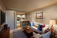 a living room with a couch and a table at ITC Grand Chola, a Luxury Collection Hotel, Chennai in Chennai
