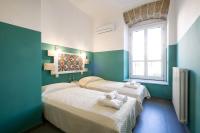 A bed or beds in a room at Cassari UpArtments