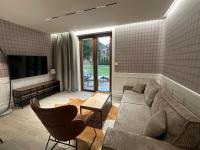 Telewizja i/lub zestaw kina domowego w obiekcie Villa Monica Apartamenty