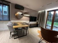 Telewizja i/lub zestaw kina domowego w obiekcie Villa Monica Apartamenty