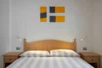 A bed or beds in a room at Casa Chatrian