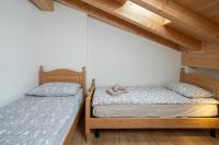 A bed or beds in a room at Casa Chatrian