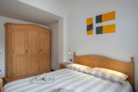 A bed or beds in a room at Casa Chatrian