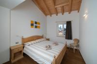 A bed or beds in a room at Casa Chatrian