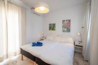 A bed or beds in a room at RESIDENSOL 13 MENYBER