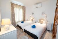 A bed or beds in a room at RESIDENSOL 13 MENYBER