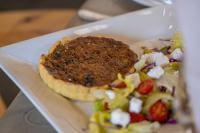 a plate of food with a salad on it at La La Nathi Country Guesthouse in Harrismith
