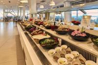 a buffet line with bowls of food in a restaurant at Enorme Santanna Island in Sissi