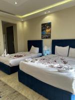 Postel nebo postele na pokoji v ubytování Pyramids Haven Hotel