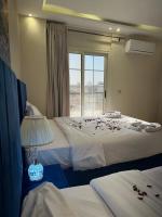 Postel nebo postele na pokoji v ubytování Pyramids Haven Hotel
